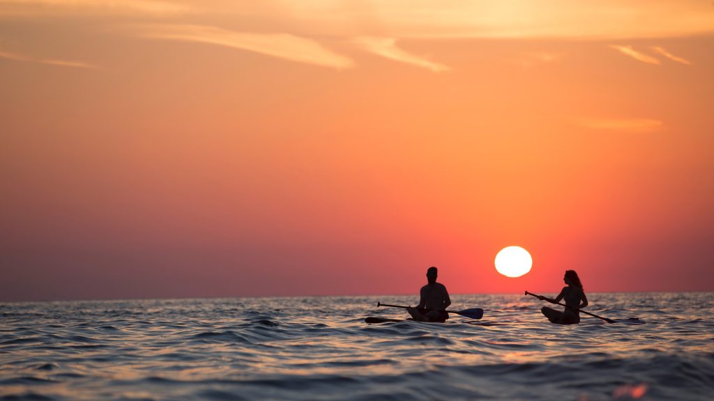 sunset-couple-rowing-boat-sea-nature-scenery-1080